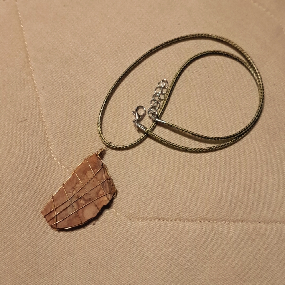 Hand crafted wire wrapped Agate stone on a 20 in nylon cord